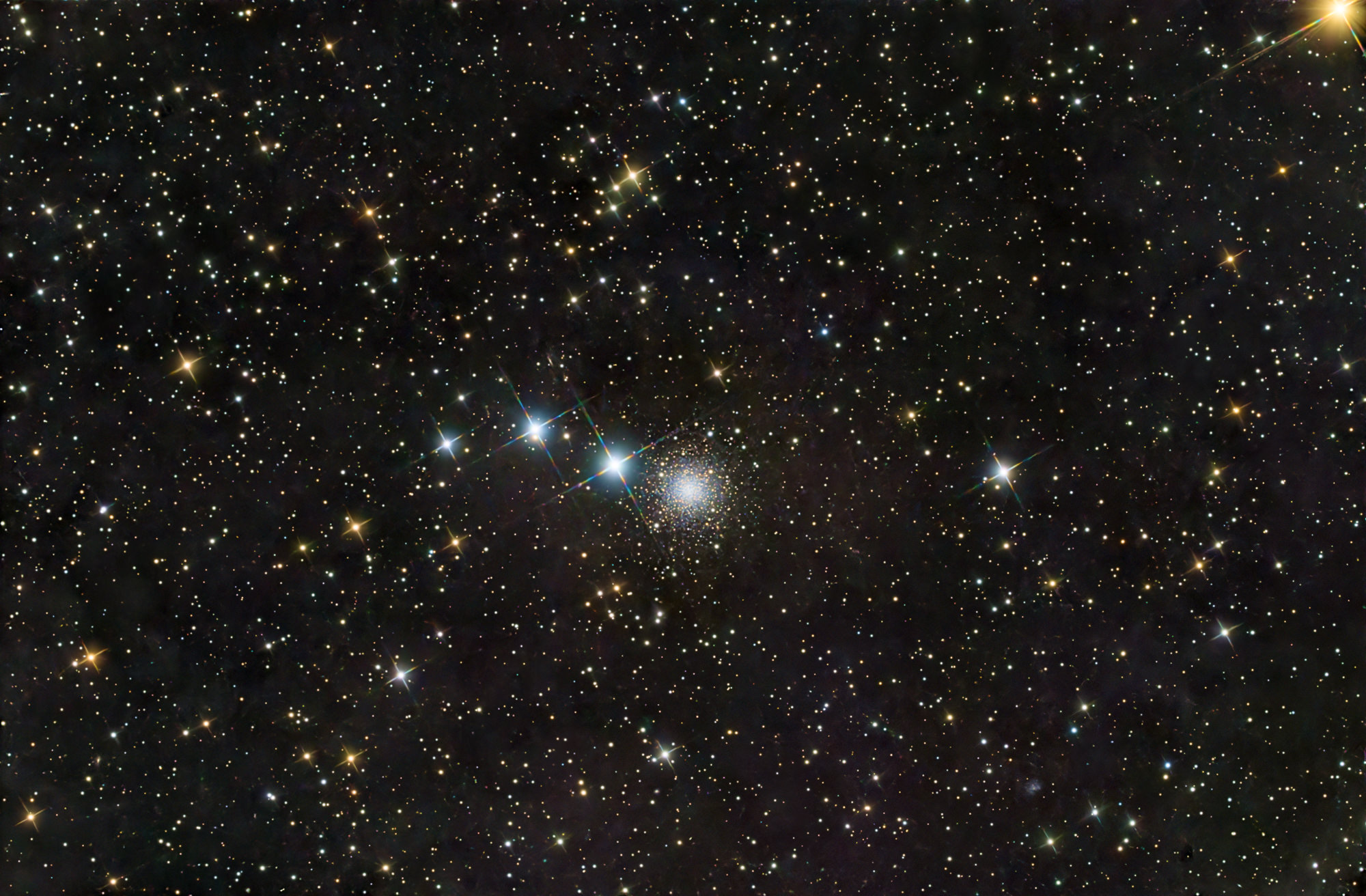 NGC 2419, also called Galactic Wanderer, is an open star cluster in the constellation of Cepheus. It is heavily reddened and contains an unusually large number of red giants and supergiants.